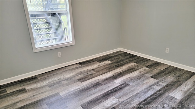 spare room featuring hardwood / wood-style flooring