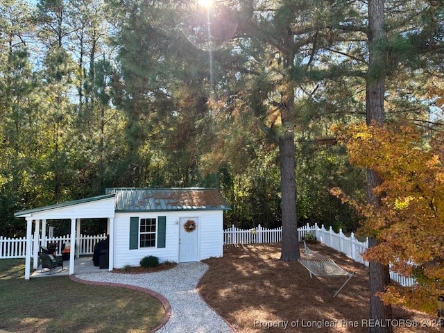 view of outbuilding with a lawn