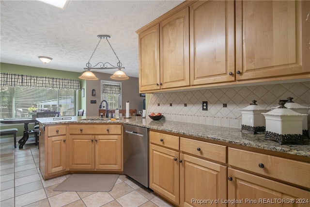 kitchen featuring dishwasher, pendant lighting, decorative backsplash, and stone counters