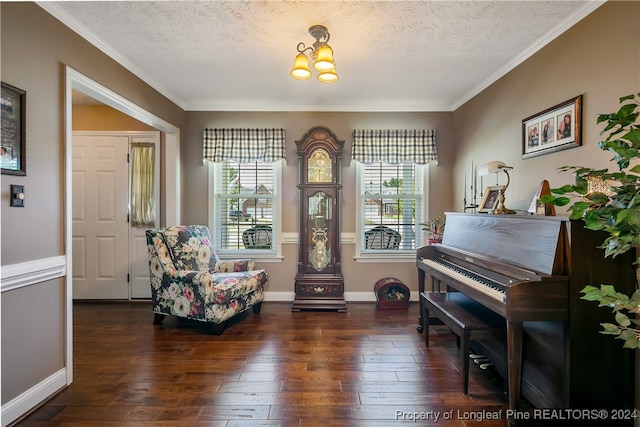 living area featuring ornamental molding, a textured ceiling, dark wood-type flooring, and a notable chandelier