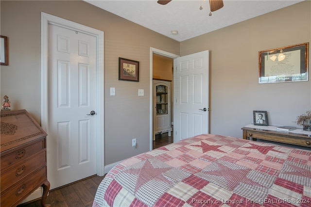 bedroom featuring dark hardwood / wood-style floors and ceiling fan