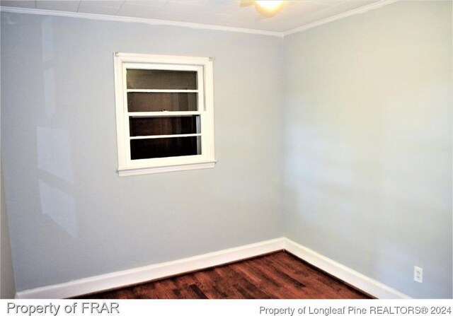 unfurnished room featuring built in features, wood-type flooring, and ornamental molding