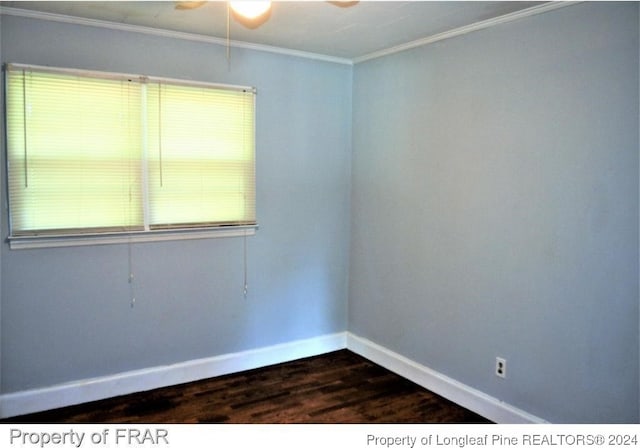 spare room with dark hardwood / wood-style flooring, ceiling fan, and ornamental molding