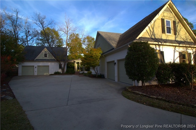 view of side of property with a garage