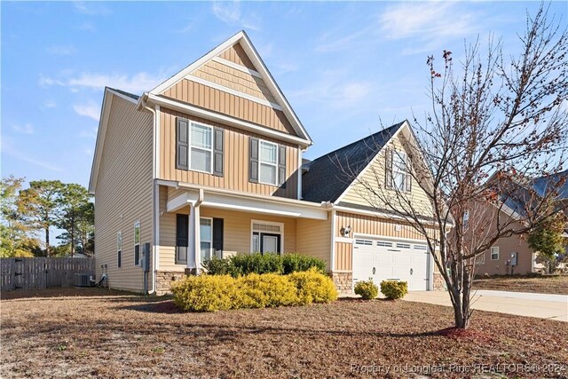 craftsman-style house featuring a garage and central air condition unit