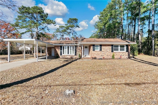 view of front of property featuring a carport