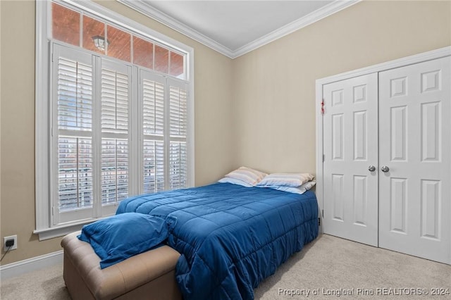 bedroom featuring multiple windows, light carpet, a closet, and ornamental molding