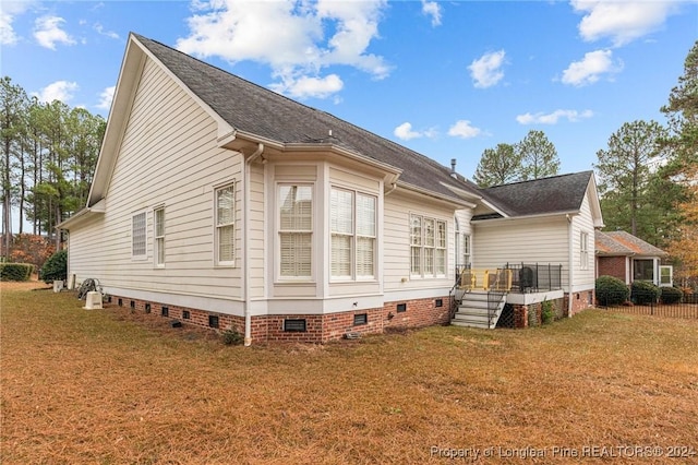 view of side of home featuring a yard