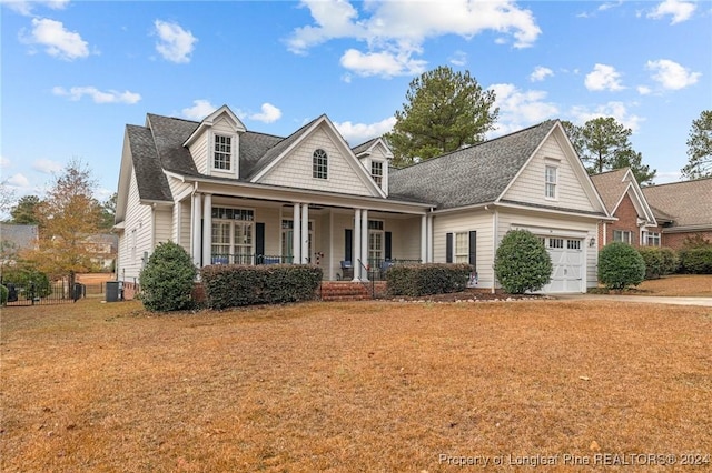 view of front of house featuring covered porch and a garage