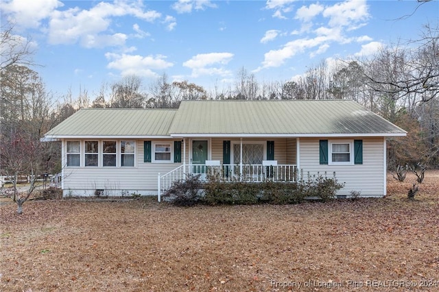 ranch-style home featuring a porch