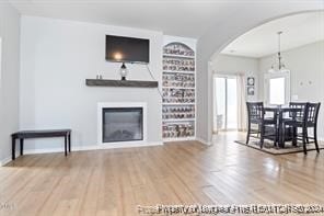 unfurnished living room featuring hardwood / wood-style floors