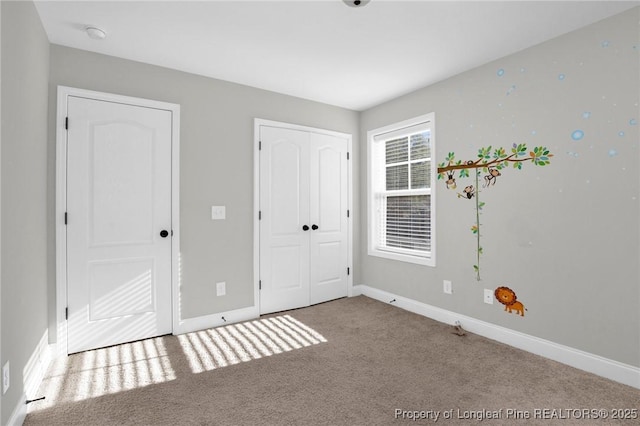 unfurnished bedroom featuring carpet flooring