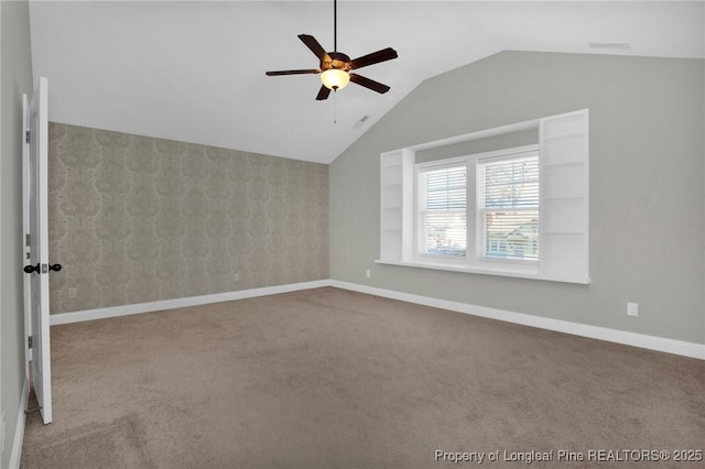 bonus room featuring light colored carpet, ceiling fan, and lofted ceiling