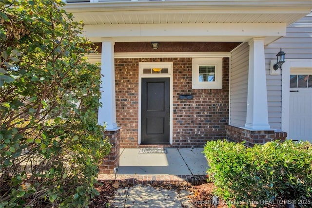 property entrance featuring covered porch