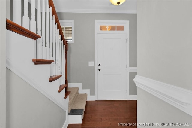 entrance foyer featuring crown molding and dark wood-type flooring