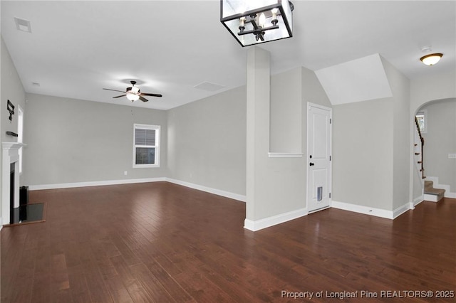 unfurnished living room with ceiling fan and dark hardwood / wood-style floors