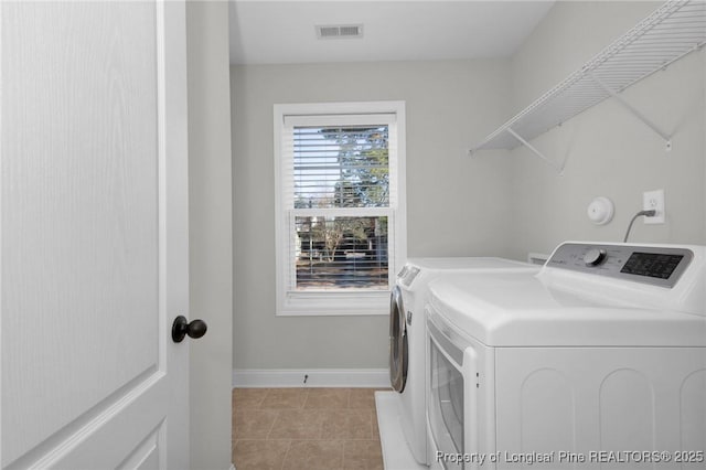 washroom with washer and dryer