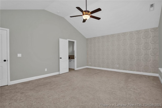 unfurnished bedroom with ceiling fan, lofted ceiling, and carpet floors