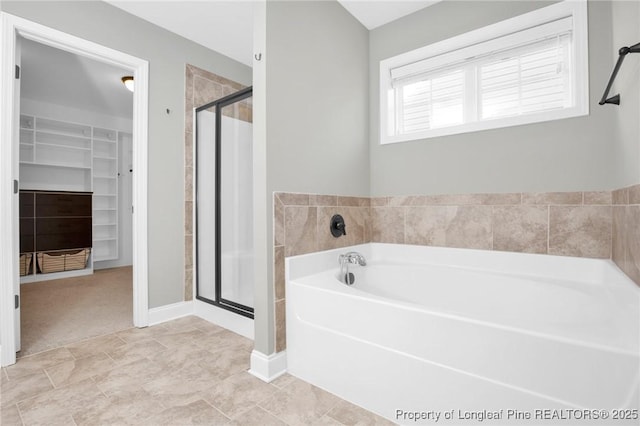 bathroom featuring independent shower and bath