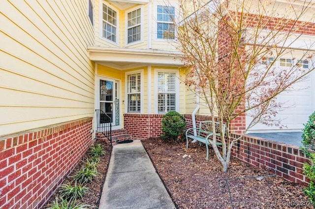 property entrance with a garage