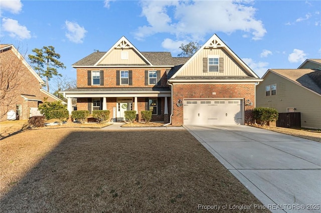 craftsman-style home featuring covered porch and a garage