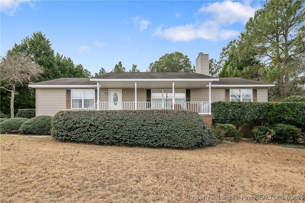 ranch-style home with a front lawn