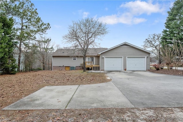 ranch-style house featuring a deck and a garage