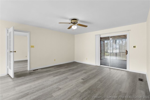 spare room featuring ceiling fan and light hardwood / wood-style floors