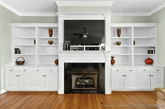 unfurnished living room featuring crown molding, light hardwood / wood-style flooring, and ceiling fan