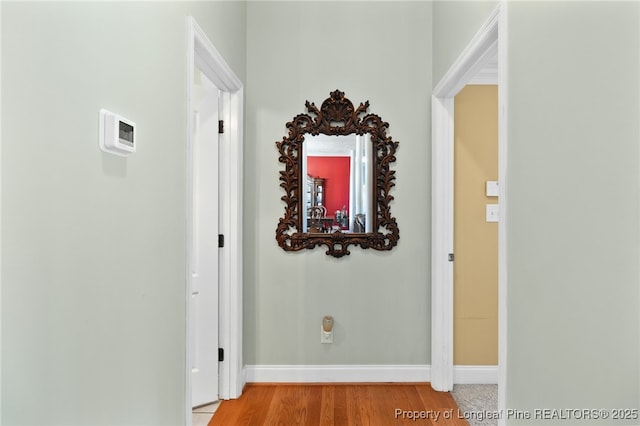 corridor featuring wood-type flooring