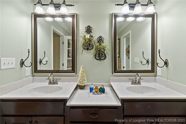 bathroom with vanity and ornamental molding