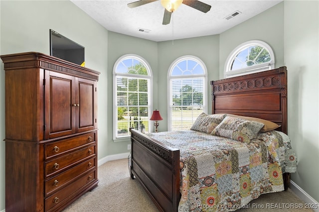 bedroom with light colored carpet and ceiling fan