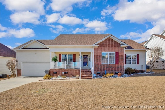 ranch-style house featuring a garage, a front lawn, and covered porch