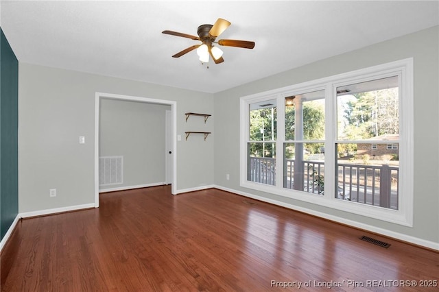 unfurnished room with ceiling fan and wood-type flooring