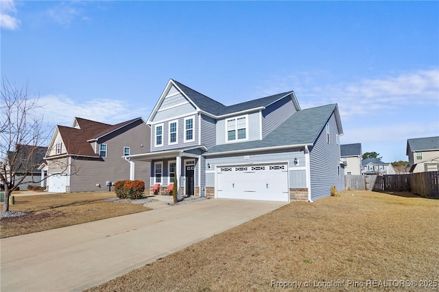 view of front of house with a garage and a front lawn