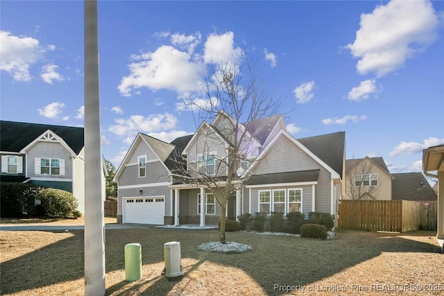 front of property with a garage and a front lawn