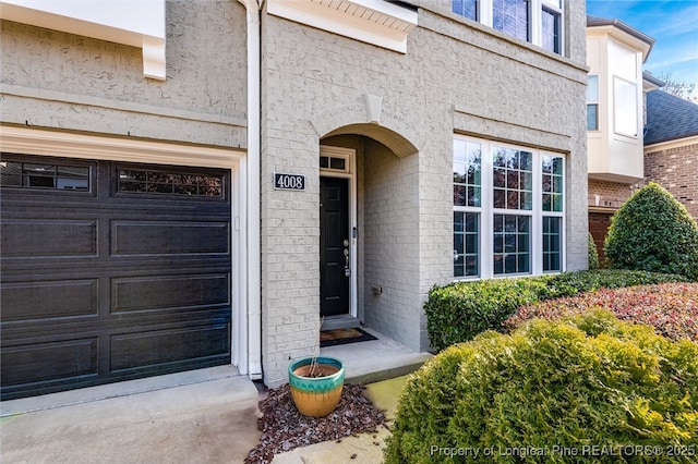 entrance to property featuring a garage