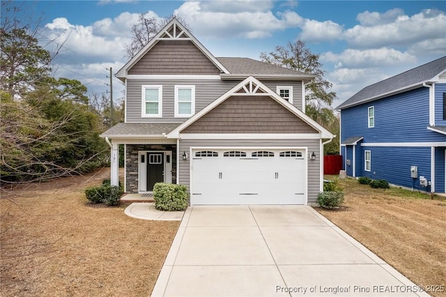 craftsman-style house with a garage and a front yard