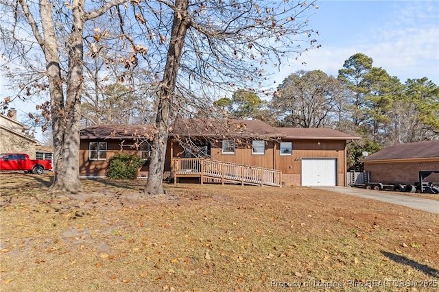 single story home with a garage and a front lawn