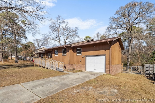 view of front of home with a garage and a front yard