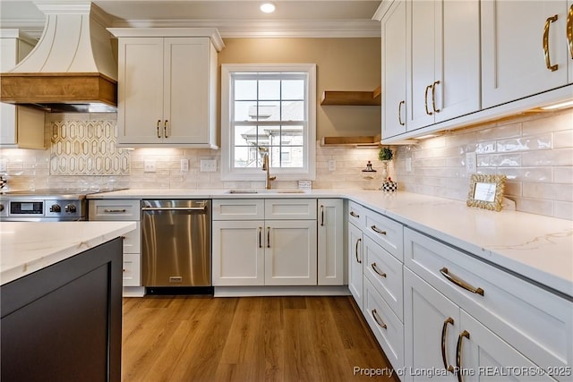 kitchen with white cabinetry, dishwasher, sink, and custom range hood