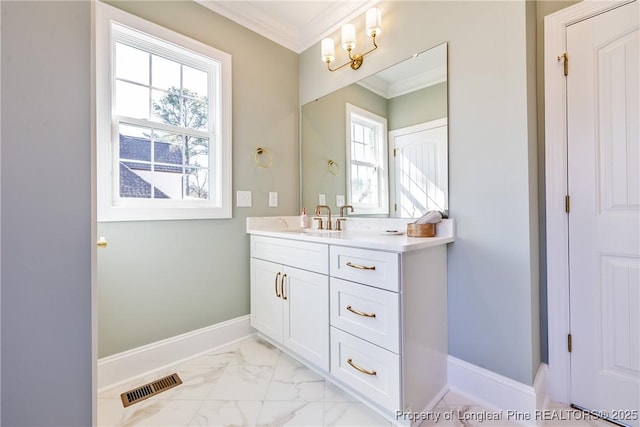 bathroom featuring crown molding and vanity