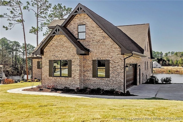 view of home's exterior with a yard and a garage