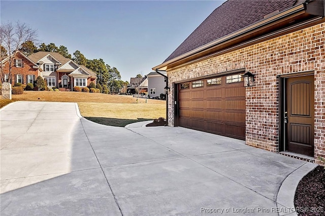 garage featuring a yard