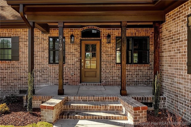 entrance to property with covered porch