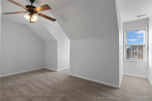 bonus room with light carpet, vaulted ceiling, and ceiling fan