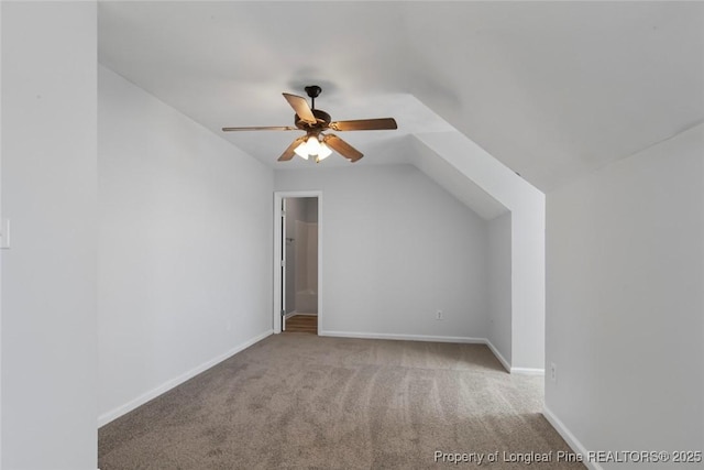 bonus room with ceiling fan, light colored carpet, and vaulted ceiling