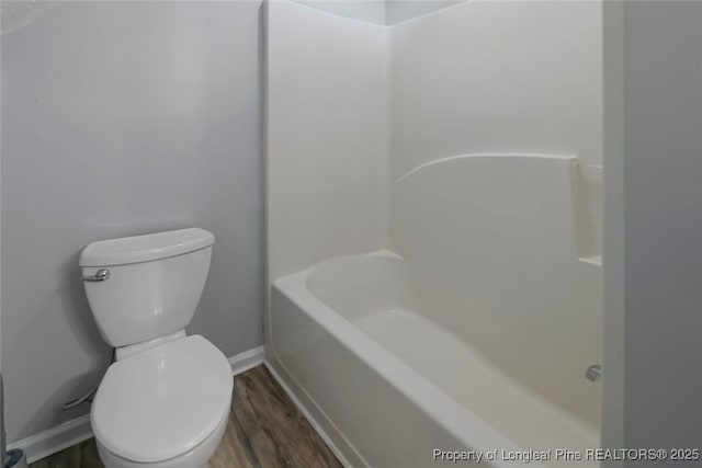 bathroom featuring independent shower and bath, hardwood / wood-style floors, and toilet