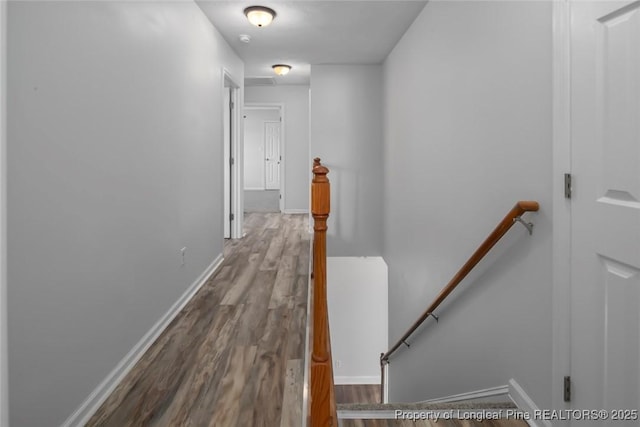 hallway with wood-type flooring