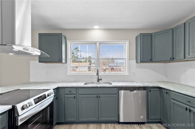 kitchen with sink, gray cabinets, island exhaust hood, and appliances with stainless steel finishes